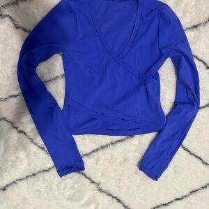 Athleta Women’s Transcend Blue Long Sleeve Wrap Top.  Size medium.